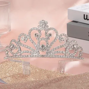 Close-up of bridal tiara with silver rhinestones and heart-shaped crystal patterns