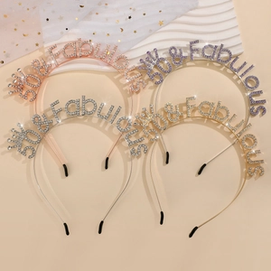 Detail of 50 and Fabulous rhinestone tiara headbands in gold, rose gold and silver finishes