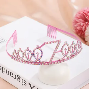 Macro detail of pink glitter tiara with number 70 and multi-colored rhinestones