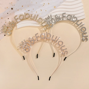 Close-up of three 80 & Fabulous rhinestone headbands in gold, silver, and rose gold