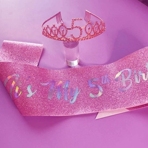 Pink 50th birthday set featuring a rhinestone tiara and sparkling glitter sash