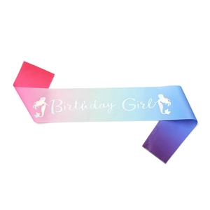 Close-up of colorful gradient satin sash with Birthday Girl text and mermaid silhouette