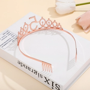 Detail of rose gold 50th birthday crown with numeric 50 design and comb grips