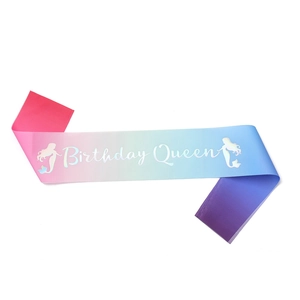 Detail of gradient satin Birthday Queen sash with colorful mermaid silhouette pattern
