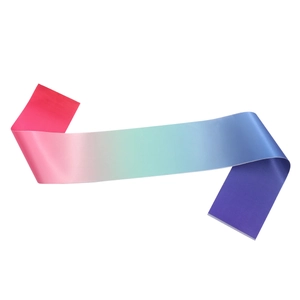 Close-up of vibrant gradient colorful satin birthday sash with smooth silk texture