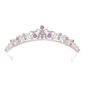 Detail of silver bridal crown featuring vintage scroll patterns and purple rhinestones