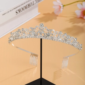 Detailed macro view of luxury silver bridal crown with glittering rhinestones on stand