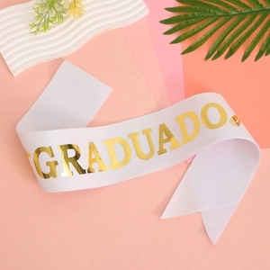 White satin graduation sash with gold foil GRADUADO lettering for ceremony celebrations