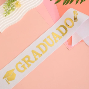 White GRADUADO graduation sash with gold glitter text and academic cap icons