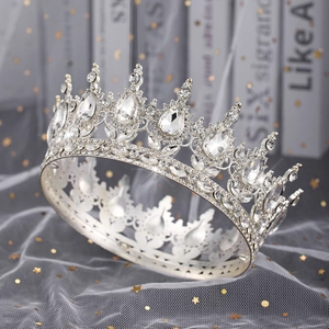 Macro detail of a silver tiara with sparkling pear-shaped rhinestones on starry tulle
