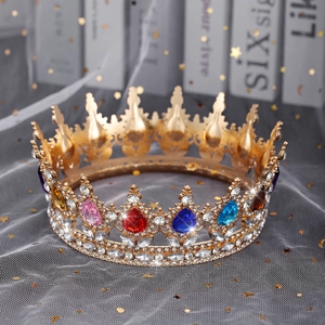 Macro shot of colorful teardrop rhinestones on golden alloy bridal tiara crown