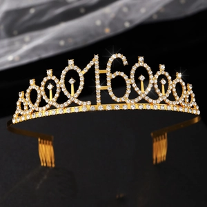 Close-up of golden birthday tiara for 16th celebration with rhinestones and hair combs