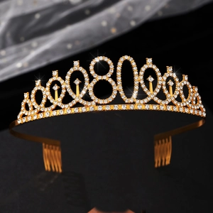 Detailed close-up of gold 80th birthday crown with rhinestones and side hair combs