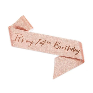 Close-up of rose gold sequin sash with brown It's my 14th Birthday text for party