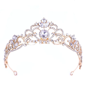 Elegant gold alloy bridal crown with white crystal rhinestones for women on white background