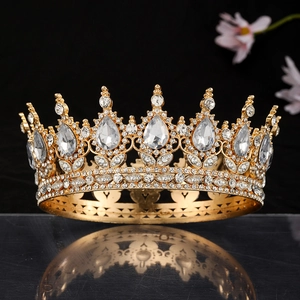 Macro view of luxurious gold bridal crown with crystal stones on reflective black surface