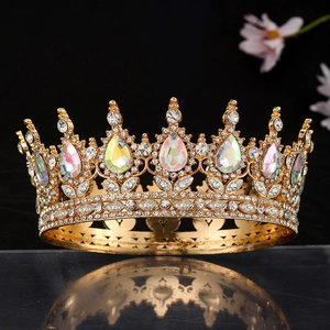 Detailed close-up of golden baroque crown with iridescent teardrop stones and rhinestones