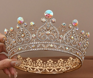 Detailed view of luxury gold crown with heart-shaped metal frame and sparkling AB crystals