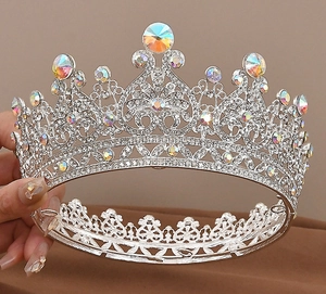 Close-up of luxury bridal crown with silver alloy, sparkling rhinestones and gems