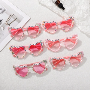Pink heart-shaped birthday sunglasses with pearls and Birthday Queen lettering