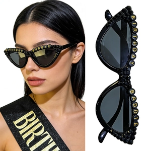 Detail of cat-eye party sunglasses with BIRTHDAY BADDIE letter beads and black frame