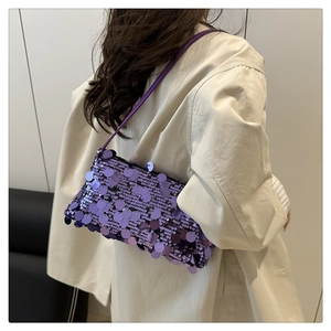 Detailed view of the purple sequin shoulder bag showing shimmering finish and texture