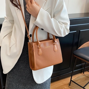 Brown lychee pattern PU leather tote bag with top handles and adjustable shoulder strap