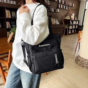 Large black nylon school bag with multi-pockets and adjustable shoulder strap