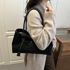 Chic black leopard print tote bag for women featuring premium suede texture and long straps