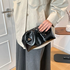 Fashionable black glossy ruched cloud clutch bag with mirror finish and soft pleated design