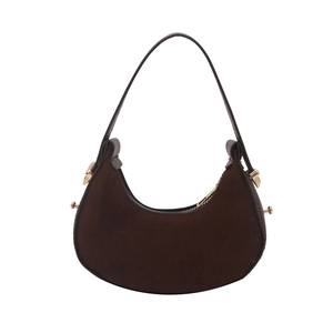 Chic dark brown faux suede crescent moon handbag with gold hardware and shoulder strap