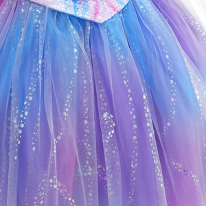 Detail of children's tulle dress with purple-blue gradient and silver sequin wave patterns