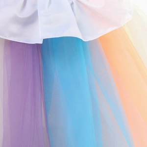 Macro view of multi-layer colorful tulle mesh and white satin hem on princess dress