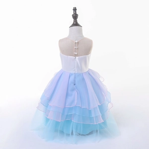 Detail of princess dress back with pearl buttons, hidden zipper, and layered tulle skirt