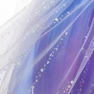 Detail of multi-layer blue-purple gradient mesh fabric with colorful sequins for girls