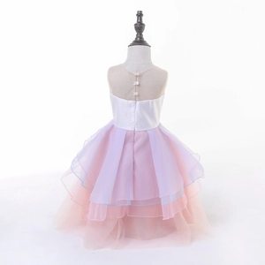 Detail of layered purple and pink tulle cake skirt back with satin bodice and buttons