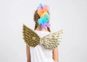 Girl wearing golden angel wings and rainbow tulle headband for festive costume party attire