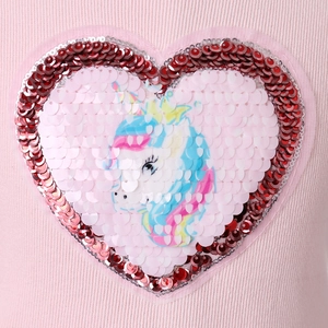 Pink knit princess dress featuring a large heart-shaped sequin unicorn patch on the chest