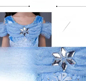 Detail of blue princess dress showing snowflake crystal and handcrafted beadwork embroidery