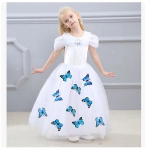 Detailed view of white princess dress with puff sleeves, beadwork and blue butterflies