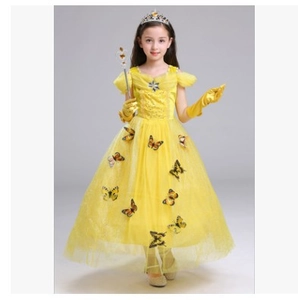 Detail of yellow princess dress with butterfly 3D appliques and matching magic wand