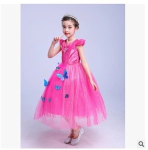 Close-up of rose pink princess dress with puffy sleeves and blue butterfly ornaments