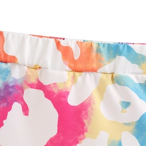 Detail of the elastic waistband and high-quality stitching on girls' colorful tie-dye shorts