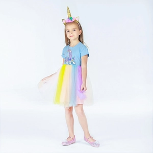 Detail of unicorn tutu dress with 3D floral embroidery and colorful rainbow mesh layers