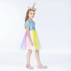 Detail of girls unicorn dress with rainbow mesh skirt and 3D flower applique