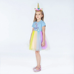 Detail of girls unicorn dress with rainbow mesh skirt and matching floral headband