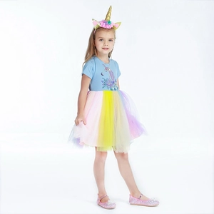 Close-up of unicorn print on light blue bodice and pastel rainbow tutu dress