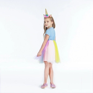 Detail of girls unicorn rainbow tulle skirt with colorful mesh layers and sequin shoes