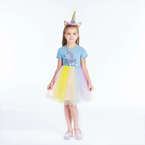 Detail of unicorn print and 3D floral accents on children rainbow mesh princess dress
