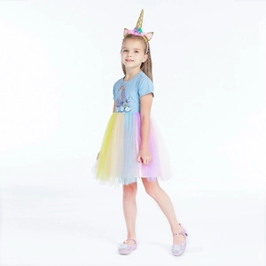 Detailed view of unicorn rainbow tulle dress with floral waist and pastel mesh skirt